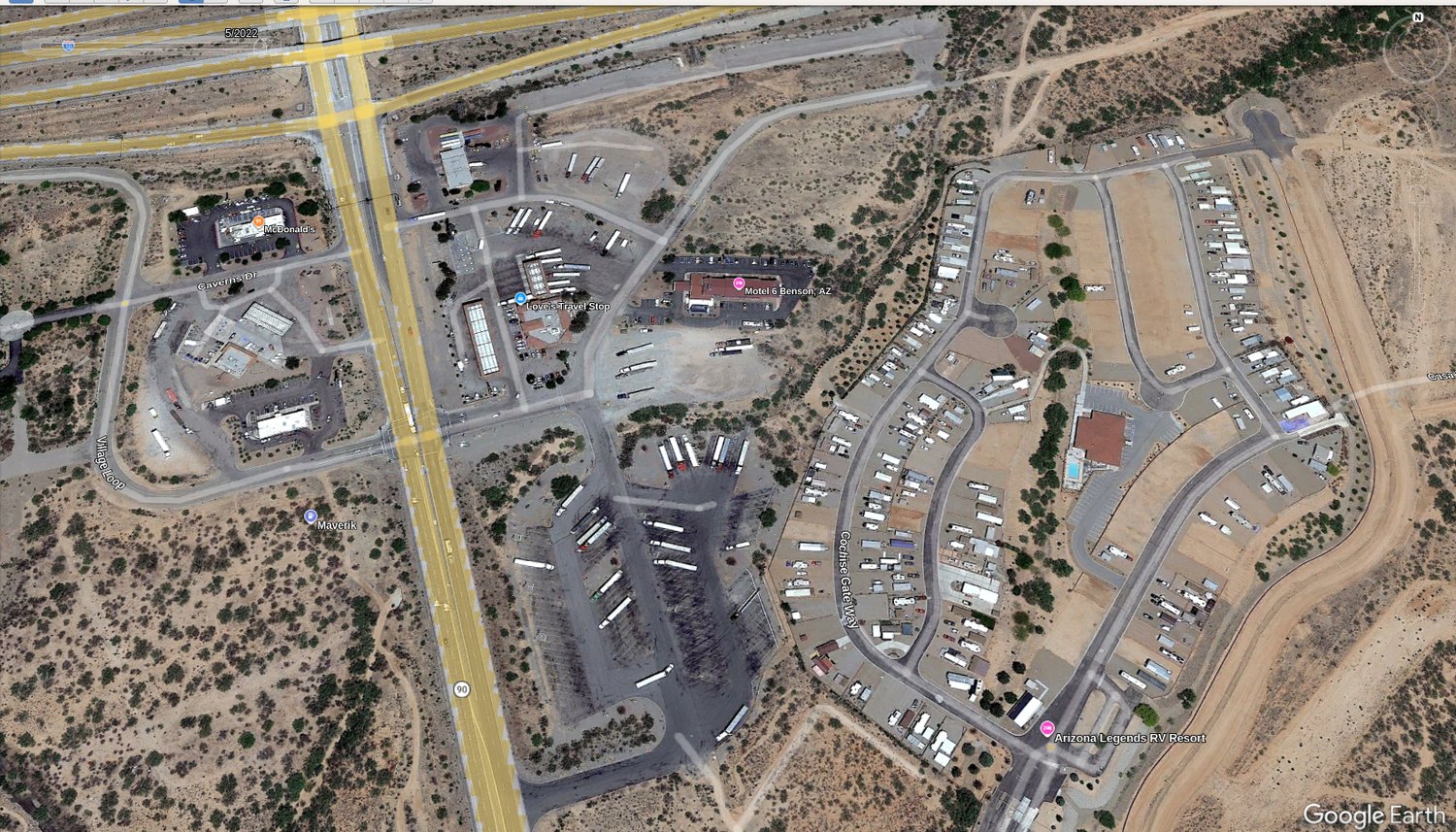 Google Earth aerial of the SR-90 Exit 302 node: Love's Travel Stop, Maverik, Motel 6, and the RV resort